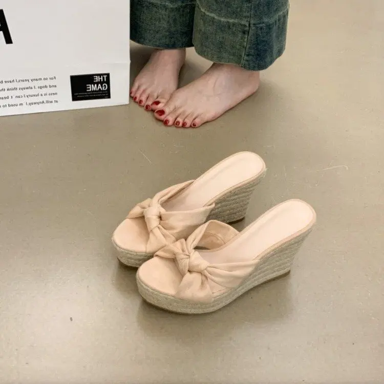 Women's bow wedge slippers summer new high heels elegant fashion wear versatile beach women's shoes
Women's bow wedge slippers summer new high heels elegant fashion wear versatile beach women's shoes