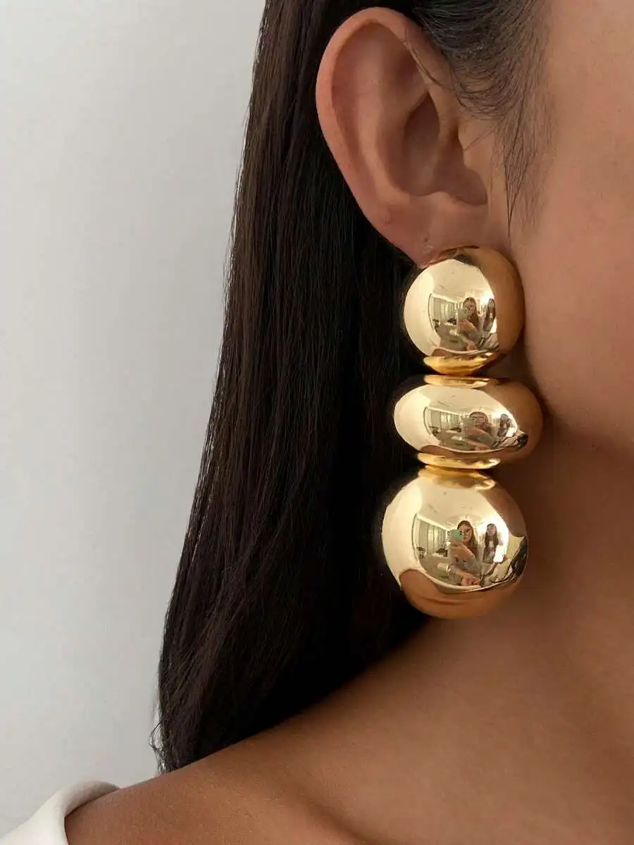 Triple Gold Sphere Statement Earrings For Women, Minimalist Retro Metal Studs With Polished Reflective Surface And Bold
Triple Gold Sphere Statement Earrings For Women, Minimalist Retro Metal Studs With Polished Reflective Surface And Bold