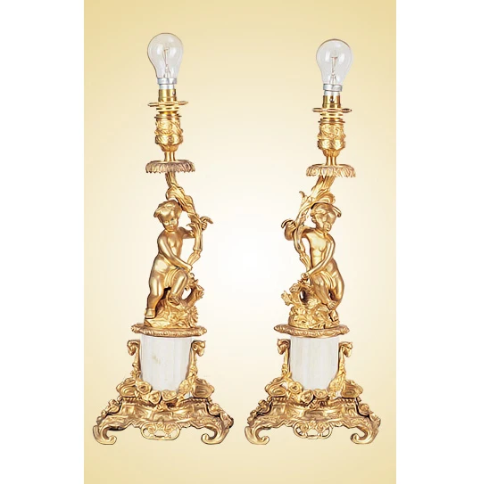 A pair of Rococo style gold-plated Cupid statues, brass Olmo copper alloy and marble dining table lamp candlesticks
A pair of Rococo style gold-plated Cupid statues, brass Olmo copper alloy and marble dining table lamp candlesticks