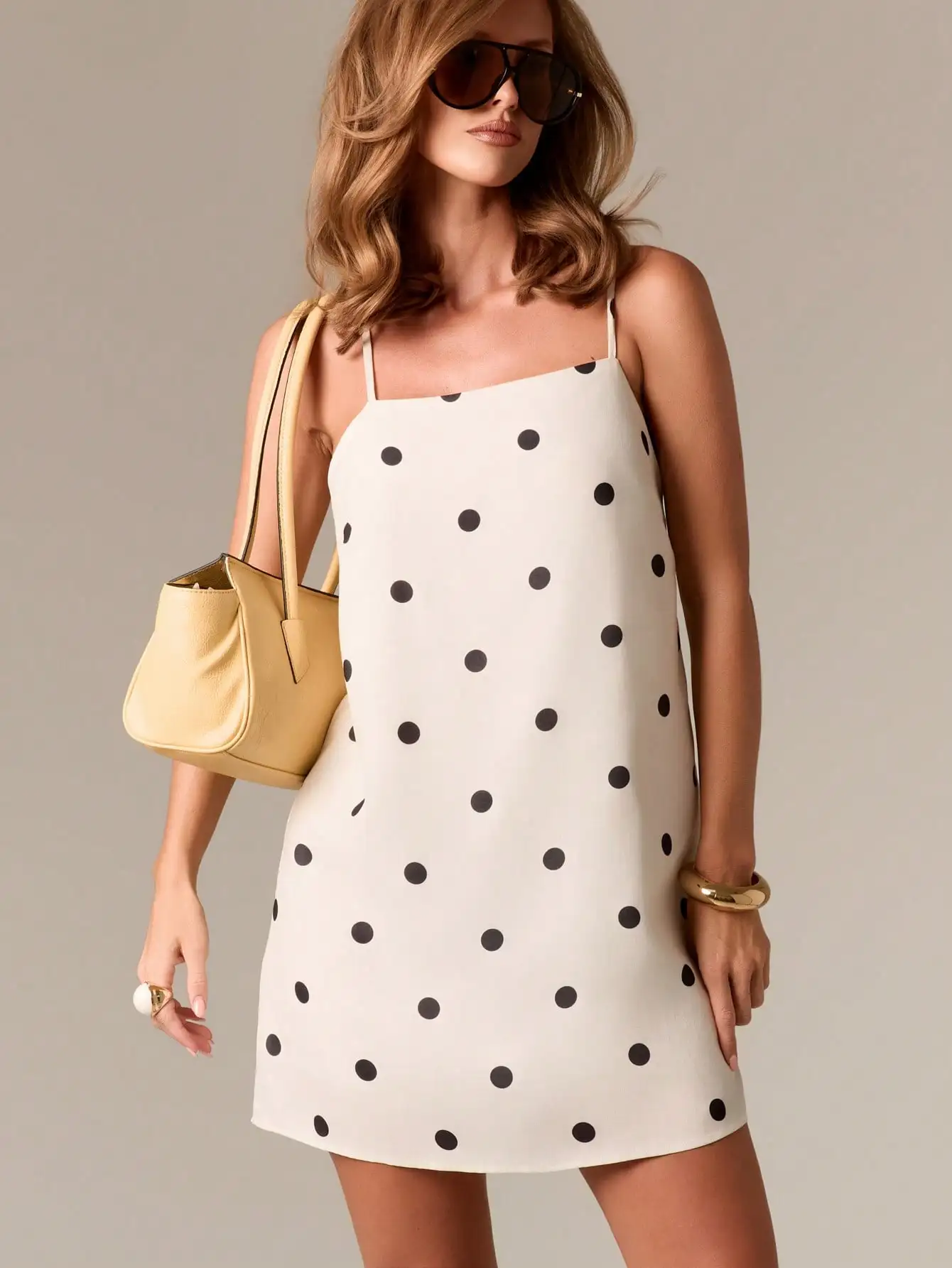 Cream Polka Dot Spaghetti Strap Mini Dress with Backless Swing A-Line Cut
Cream Polka Dot Spaghetti Strap Mini Dress with Backless Swing A-Line Cut