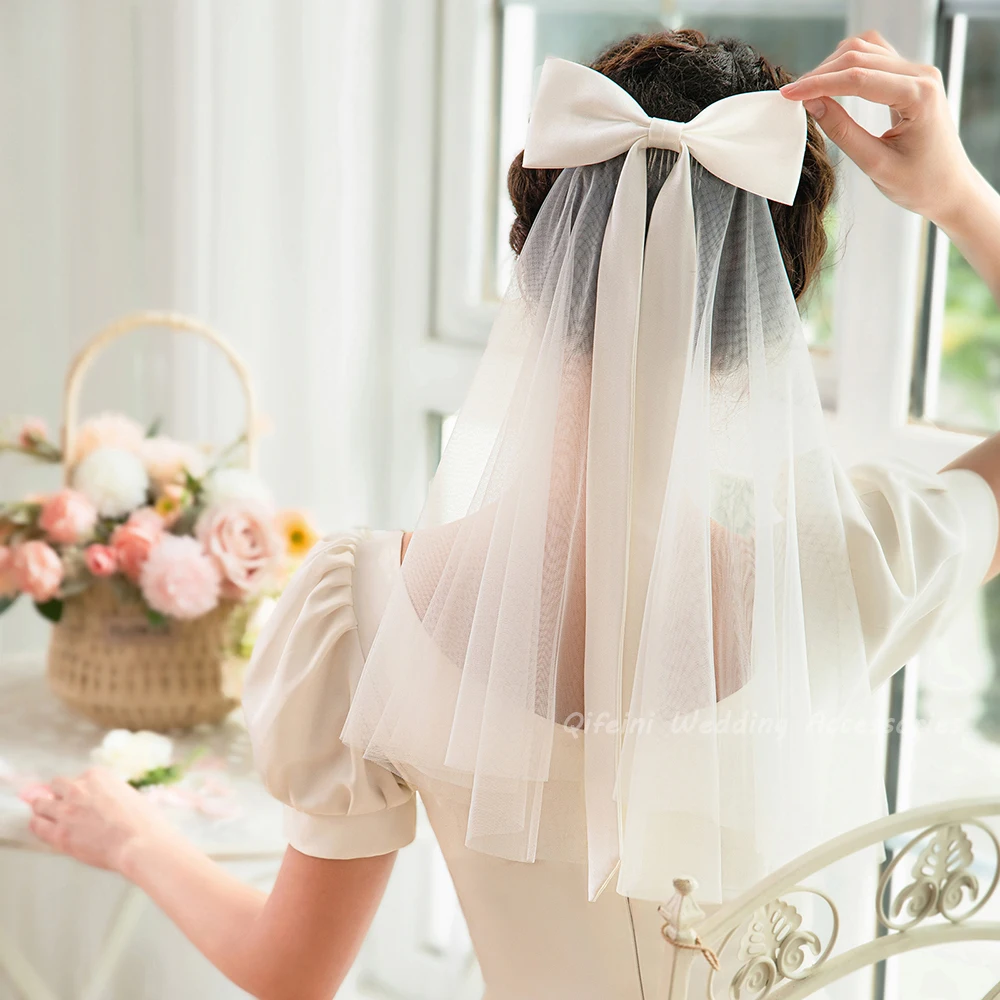 Elegant Satin Bowknot Short Bridal Veils Soft Tulle Shoulder Length Wedding Veil with Comb
Elegant Satin Bowknot Short Bridal Veils Soft Tulle Shoulder Length Wedding Veil with Comb