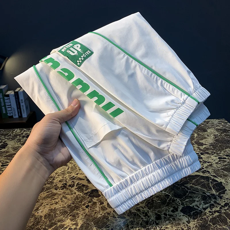2025 quick drying casual pants men's ice silk nine point tied foot summer ultra-thin trendy brand printed sports pants
2025 quick drying casual pants men's ice silk nine point tied foot summer ultra-thin trendy brand printed sports pants
