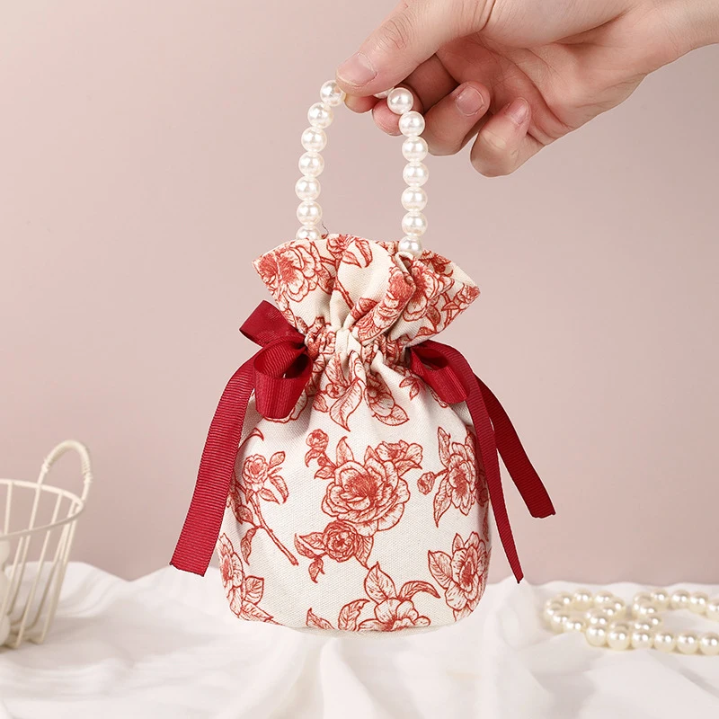 Small Flower Pearl Chain Handle Jewelry Pouch Packaging Bag Floral Canvas Drawstring Bag Wedding Candy Bag Bowknot Bag
Small Flower Pearl Chain Handle Jewelry Pouch Packaging Bag Floral Canvas Drawstring Bag Wedding Candy Bag Bowknot Bag