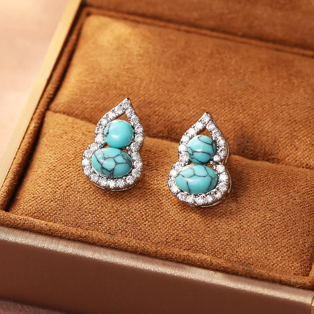 Fashionable and exquisite turquoise gourd zircon earrings light luxury high-end earrings niche design earrings for women
Fashionable and exquisite turquoise gourd zircon earrings light luxury high-end earrings niche design earrings for women