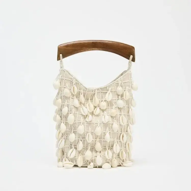 BEADED FABRIC BUCKET BAG, Luxury Designer Hollow Out Handbags, Women's Leisure Outdoor Bag with Conch
BEADED FABRIC BUCKET BAG, Luxury Designer Hollow Out Handbags, Women's Leisure Outdoor Bag with Conch