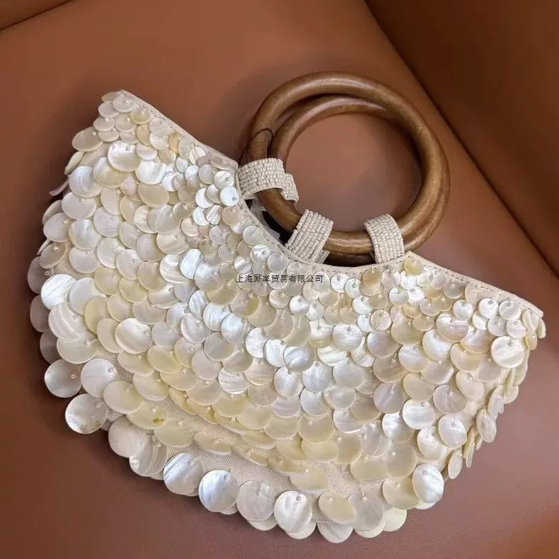 New high-end pure handmade natural shell bag fairy portable girl bag niche bag personality trend
New high-end pure handmade natural shell bag fairy portable girl bag niche bag personality trend