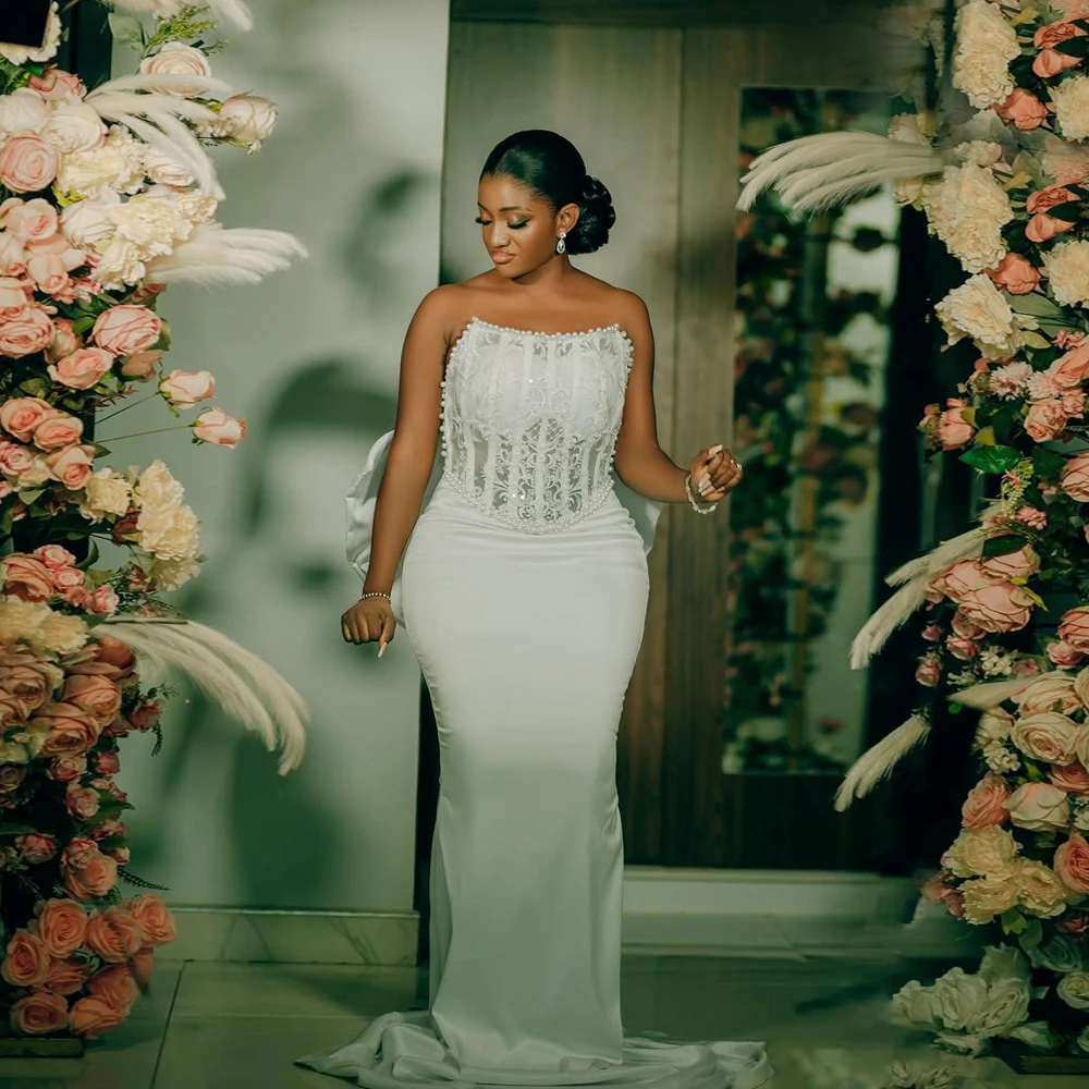 Customized Sleeveless African Luxury Wedding Dress With Bow Mermaid Beaded Applique Satin Wedding Party Dresses Sweep Train
Customized Sleeveless African Luxury Wedding Dress With Bow Mermaid Beaded Applique Satin Wedding Party Dresses Sweep Train