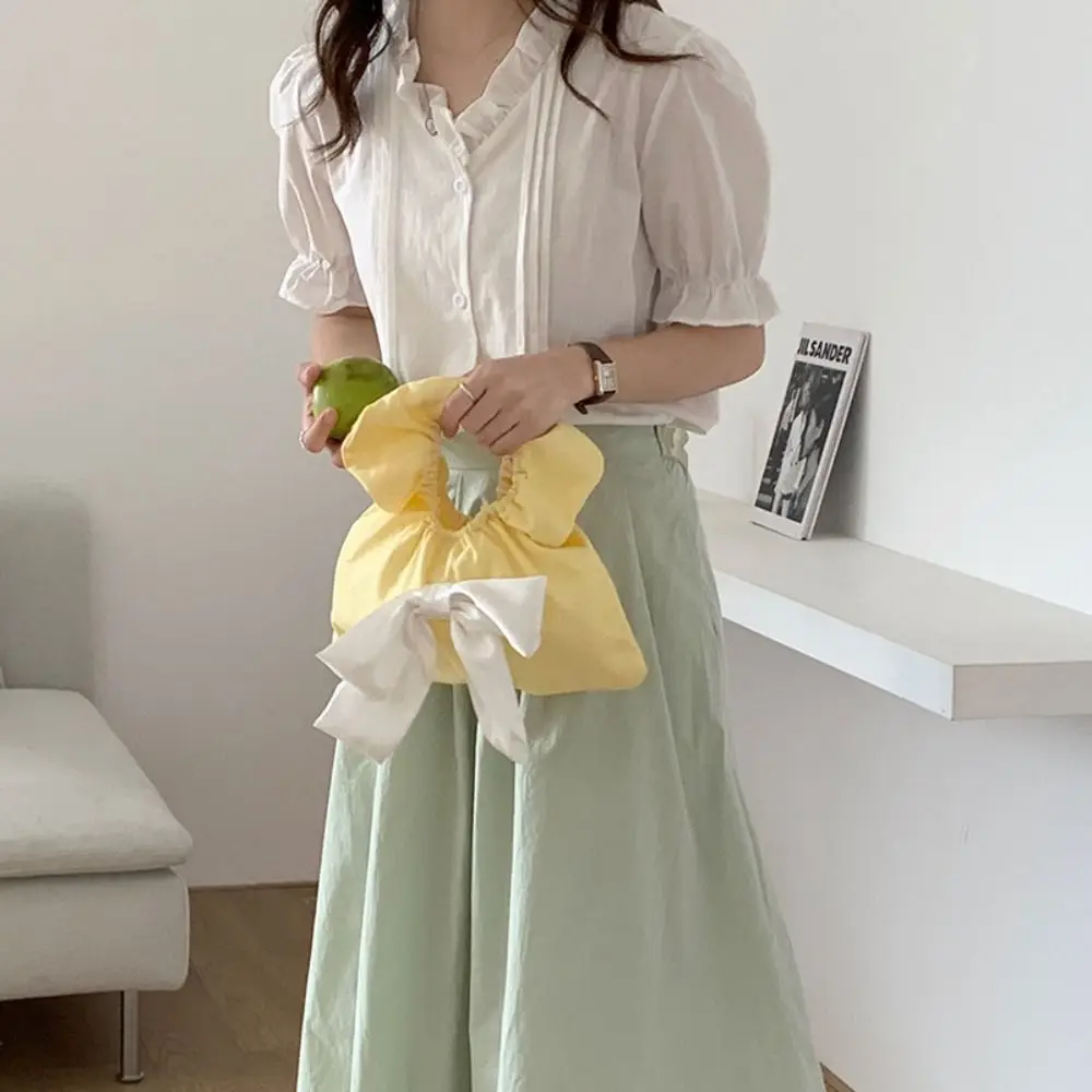 Портативная парусиновая сумка на запястье с бантом, кружевная морщинистая весенняя сумка для прогулок, большая вместительная женская маленькая сумочка в корейском стиле, сумки для хранения
Портативная парусиновая сумка на запястье с бантом, кружевная морщинистая весенняя сумка для прогулок, большая вместительная женская маленькая сумочка в корейском стиле, сумки для хранения