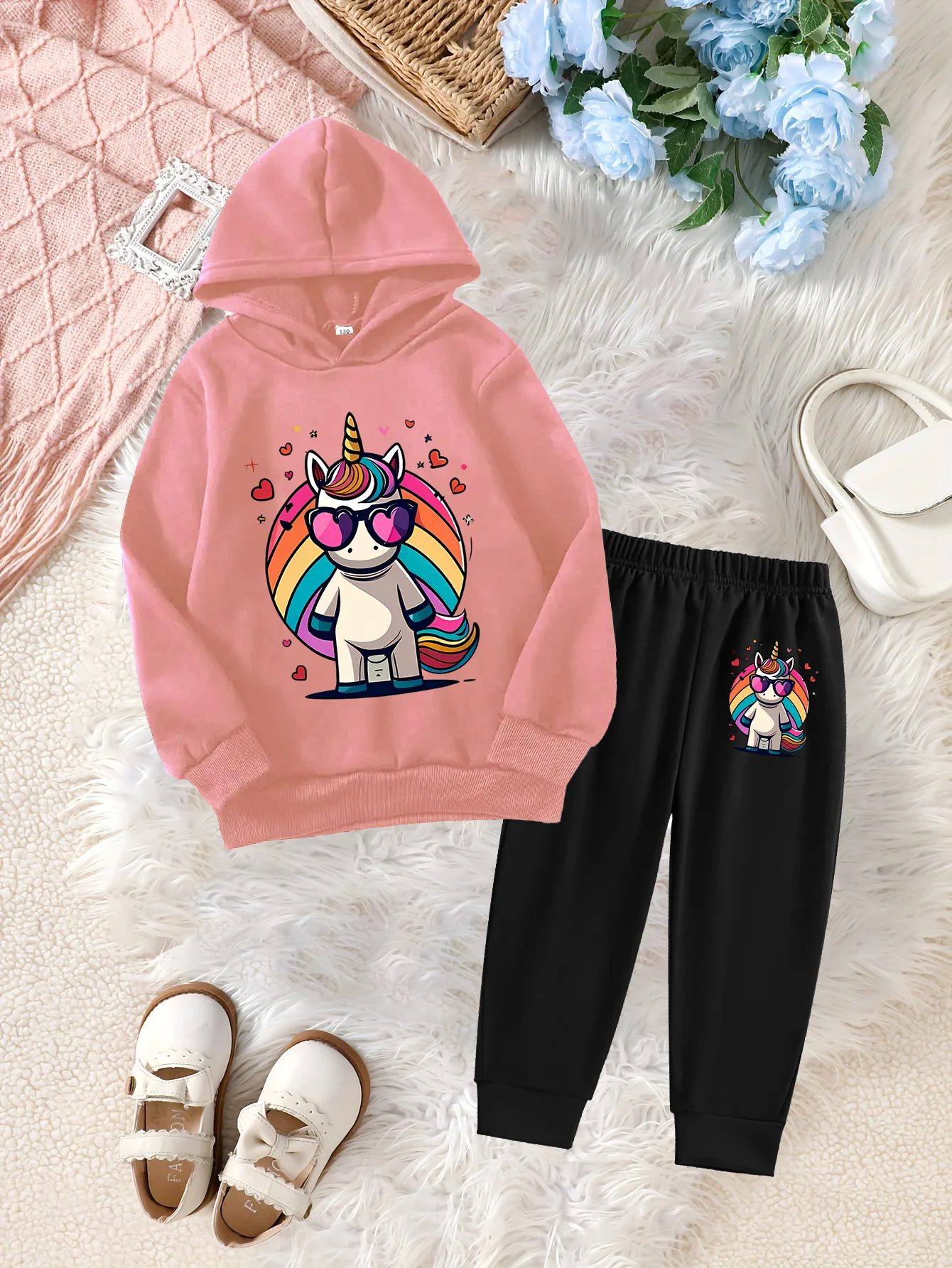 The Stylish Pink Hoodie Is Paired With Black Sweatpants, And The Colorful Unicorn Print Is Unique
The Stylish Pink Hoodie Is Paired With Black Sweatpants, And The Colorful Unicorn Print Is Unique