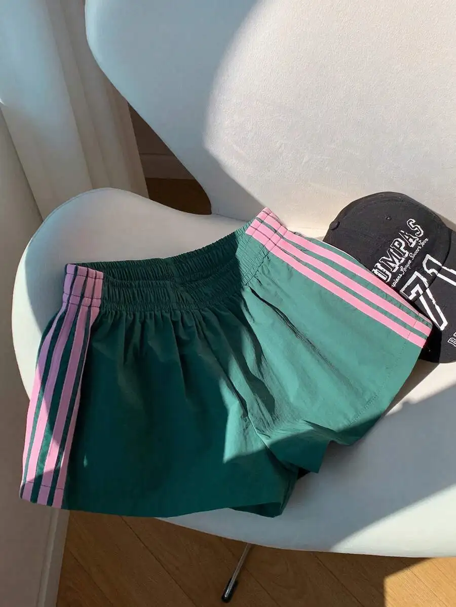 Green Womens Loose Summer Shorts With Pink Side Stripes And Elastic Waistband
Green Womens Loose Summer Shorts With Pink Side Stripes And Elastic Waistband