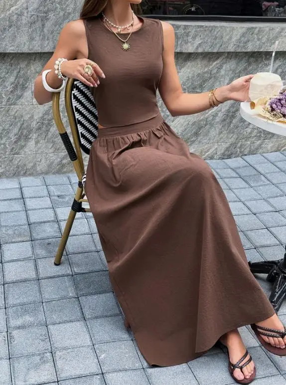 Two Piece Set Women Outfit 2026 Spring Summer Solid Color Round Neck Sleeveless Backless Vest Top & High Waist Long Skirt Set
Two Piece Set Women Outfit 2026 Spring Summer Solid Color Round Neck Sleeveless Backless Vest Top & High Waist Long Skirt Set