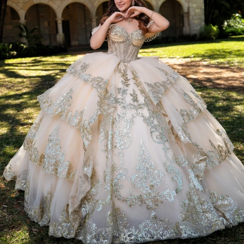 Champagne Shiny Ball Gown Quinceanera Dresses Sequin Applique Lace Beading Crystal Tiered Tull Off Shoulder Sweet 16 Dress
Champagne Shiny Ball Gown Quinceanera Dresses Sequin Applique Lace Beading Crystal Tiered Tull Off Shoulder Sweet 16 Dress