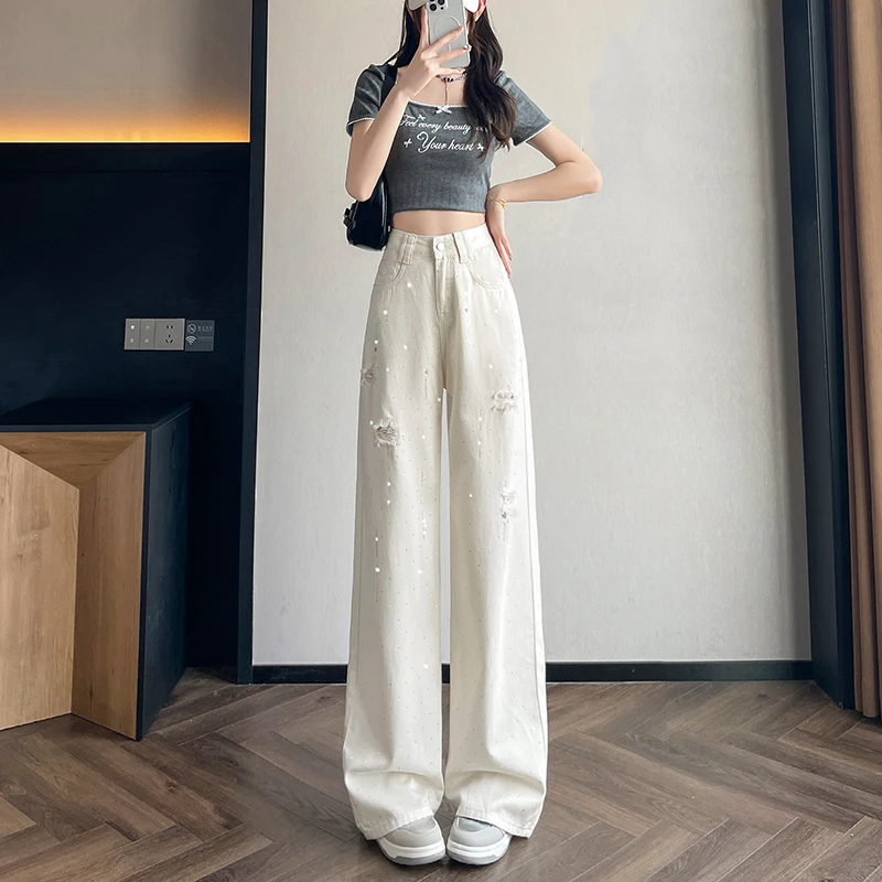 Fashion Rhinestone White Jeans Women High Waist Casual Hole Ripped Loose Wide Leg Pants Summer Female Trousers 
Fashion Rhinestone White Jeans Women High Waist Casual Hole Ripped Loose Wide Leg Pants Summer Female Trousers