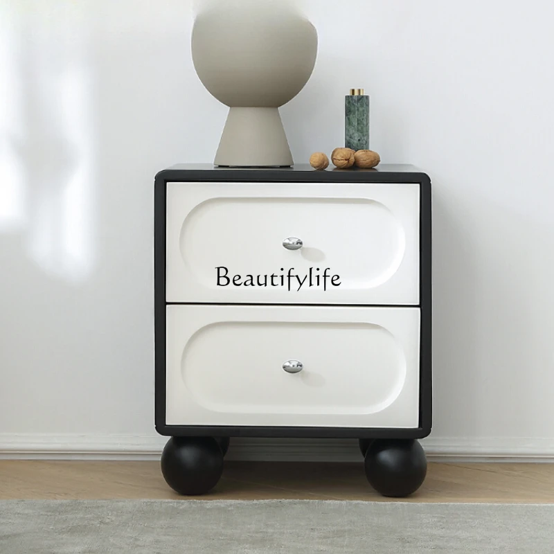 French cream antique bedside table bedroom modern simple retro black and white solid wood bedside cabinet
French cream antique bedside table bedroom modern simple retro black and white solid wood bedside cabinet