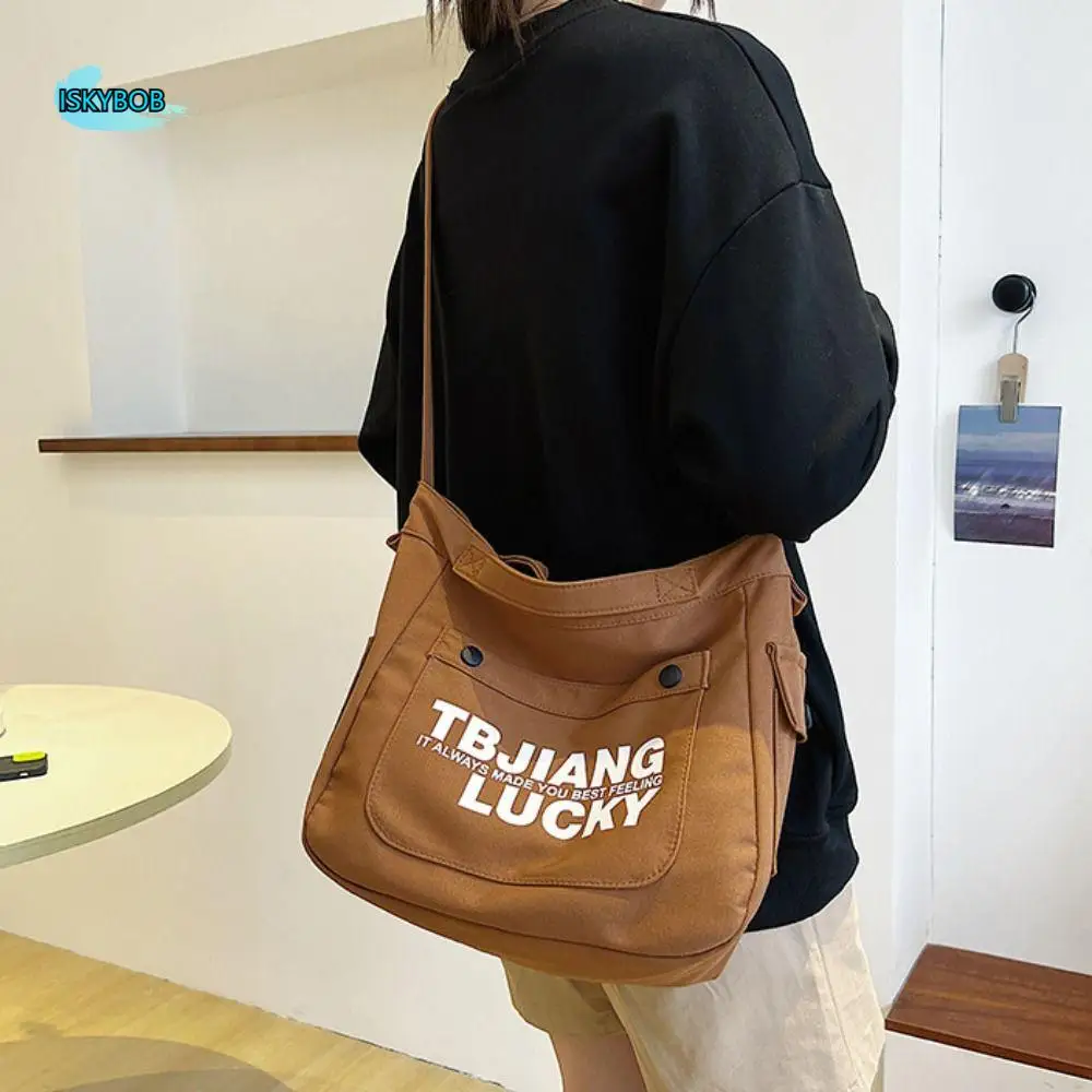 Casual Large Capacity Canvas Bag Letter Printed Handbag Letter Shoulder Bag Simple Commute Cloth Crossbody Bag Girls
Casual Large Capacity Canvas Bag Letter Printed Handbag Letter Shoulder Bag Simple Commute Cloth Crossbody Bag Girls