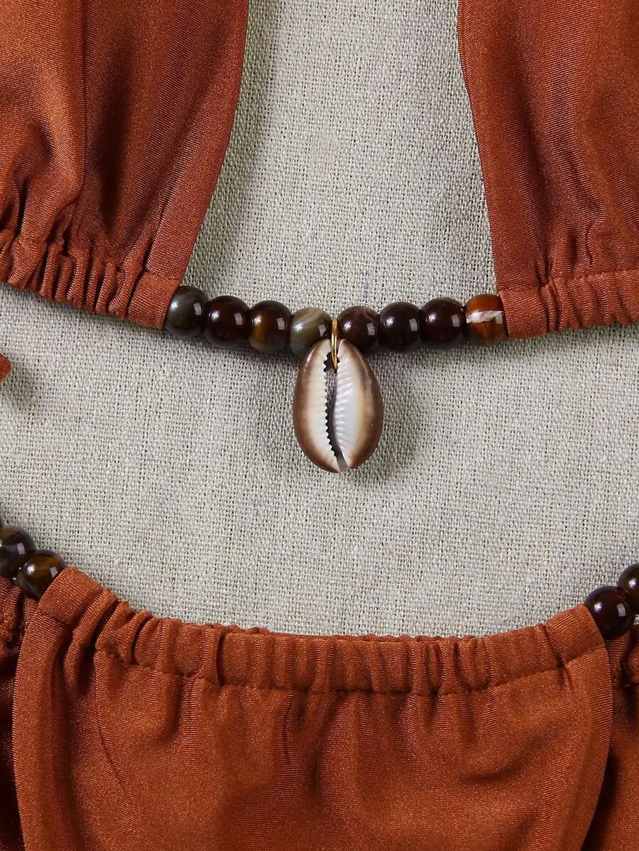 Women Brown Beaded Shell Halter Bikini Set For Beach Party Vacation
Women Brown Beaded Shell Halter Bikini Set For Beach Party Vacation