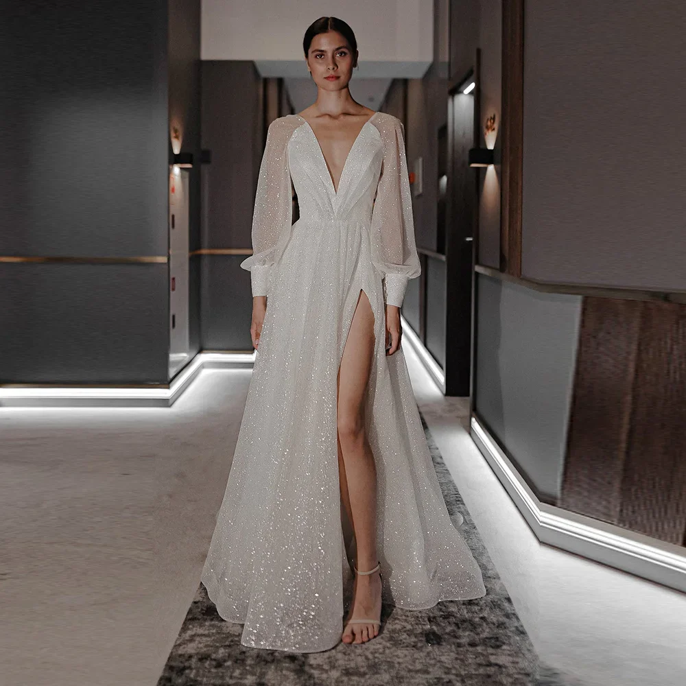 Exquisite Tulle Wedding Dresses A-Line Side Split Deep V-Neck Long Sleeve Robe De mariée Glitter Sequin Bridal Gowns Sweep Train
Exquisite Tulle Wedding Dresses A-Line Side Split Deep V-Neck Long Sleeve Robe De mariée Glitter Sequin Bridal Gowns Sweep Train