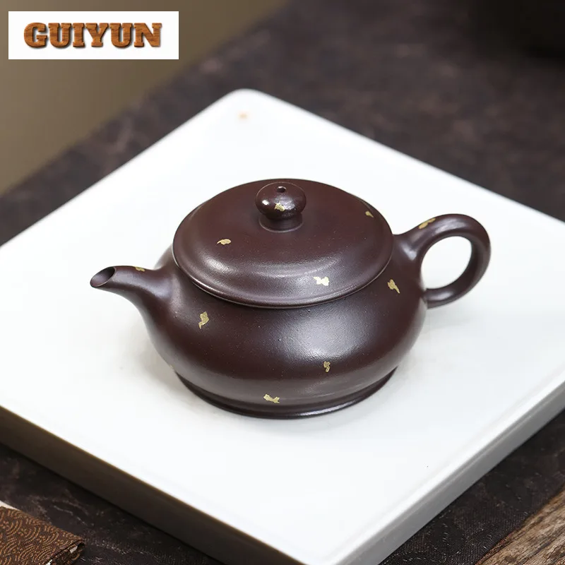 130ml Creative Yixing Purple Clay Teapot Handmade Sprinkle Gold Ming Stove Pot Raw Ore Purple Mud Tea Making Kettle Zisha Teaset
130ml Creative Yixing Purple Clay Teapot Handmade Sprinkle Gold Ming Stove Pot Raw Ore Purple Mud Tea Making Kettle Zisha Teaset