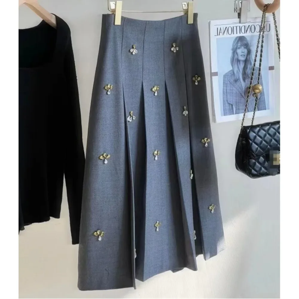 Элегантные плиссированные юбки с кристаллами для женщин, весна-осень-зима 2025, новая однотонная корейская юбка трапециевидной формы с высокой талией, женское платье Faldas
Элегантные плиссированные юбки с кристаллами для женщин, весна-осень-зима 2025, новая однотонная корейская юбка трапециевидной формы с высокой талией, женское платье Faldas