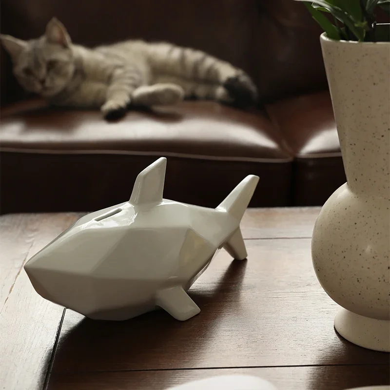 Three-dimensional shark piggy bank, creative ceramic ornaments, modern home desktop decoration
Three-dimensional shark piggy bank, creative ceramic ornaments, modern home desktop decoration
