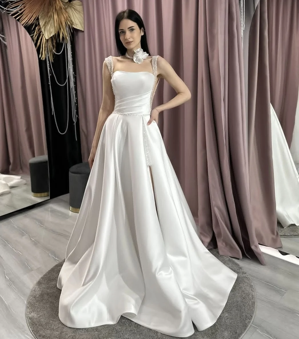 Свадебное платье по индивидуальному заказу 2025 года, мягкие атласные свадебные платья трапециевидной формы на бретельках с бисером и кристаллами, элегантные для женщин
Свадебное платье по индивидуальному заказу 2025 года, мягкие атласные свадебные платья трапециевидной формы на бретельках с бисером и кристаллами, элегантные для женщин