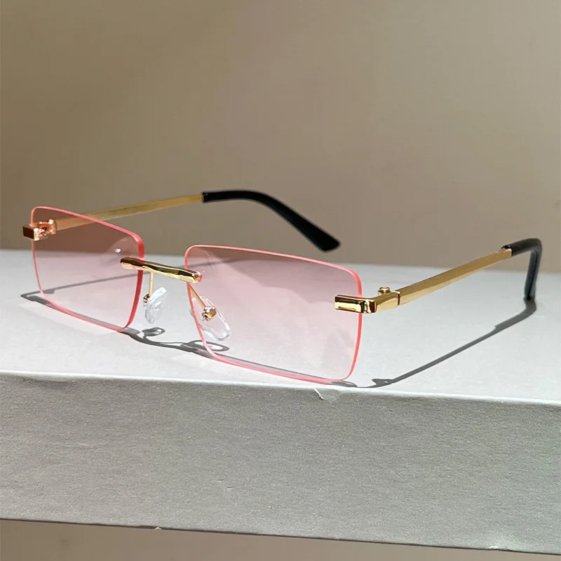 Rimless Sunglasses for Women Men Retro Fashion Gold Metal Frame UV400 Protection Rectangle Shades for Streetwear Party Vacation
Rimless Sunglasses for Women Men Retro Fashion Gold Metal Frame UV400 Protection Rectangle Shades for Streetwear Party Vacation
