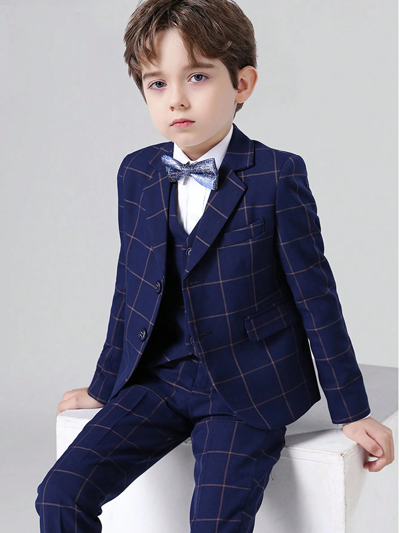 Boys Navy Blue Windowpane Plaid 3-Piece Formal Suit Set with Bow Tie for Weddings & Events
Boys Navy Blue Windowpane Plaid 3-Piece Formal Suit Set with Bow Tie for Weddings & Events
