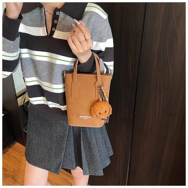 Retro Suede Mini Bucket Tote Bag with Teddy Bear , Detachable Strap, Casual Style for Work, School, Travel & Everyday Errands
Retro Suede Mini Bucket Tote Bag with Teddy Bear , Detachable Strap, Casual Style for Work, School, Travel & Everyday Errands