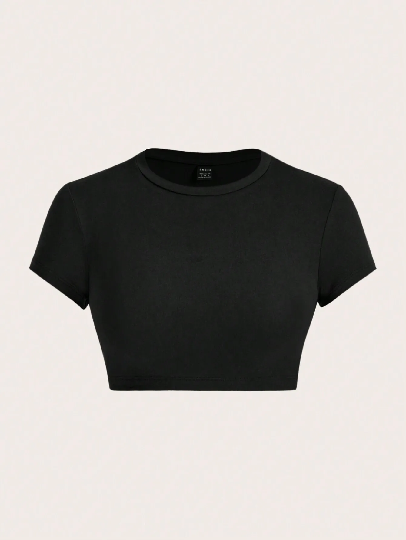 Женская минималистичная однотонная черная укороченная футболка с круглым вырезом и коротким рукавом для летних образов
Женская минималистичная однотонная черная укороченная футболка с круглым вырезом и коротким рукавом для летних образов