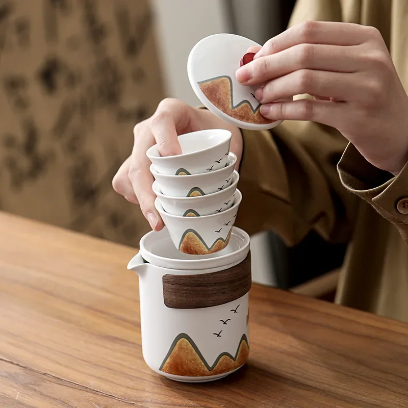 Outdoor travel tea set, household use, one pot, four cups, portable ceramic quick guest cup, teapot
Outdoor travel tea set, household use, one pot, four cups, portable ceramic quick guest cup, teapot