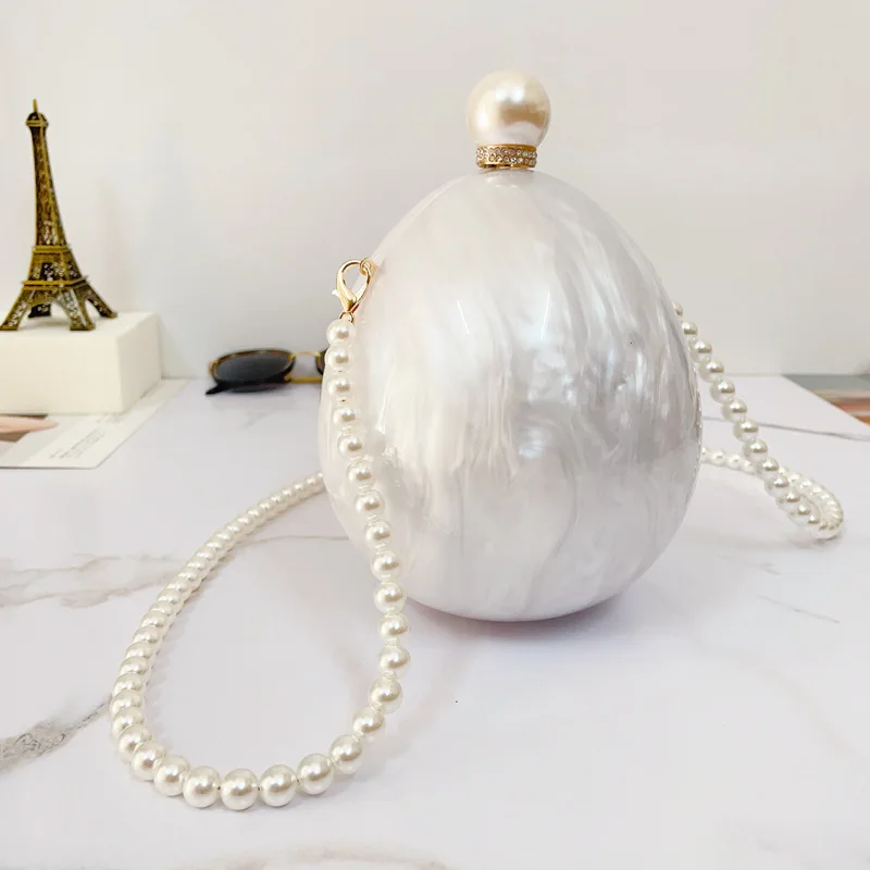 Wedding Oval Egg Clutch Purse Acrylic White Luxury Messenger Bags Pearl Long Chain Handbags for Women's Shoulder Bag
Wedding Oval Egg Clutch Purse Acrylic White Luxury Messenger Bags Pearl Long Chain Handbags for Women's Shoulder Bag