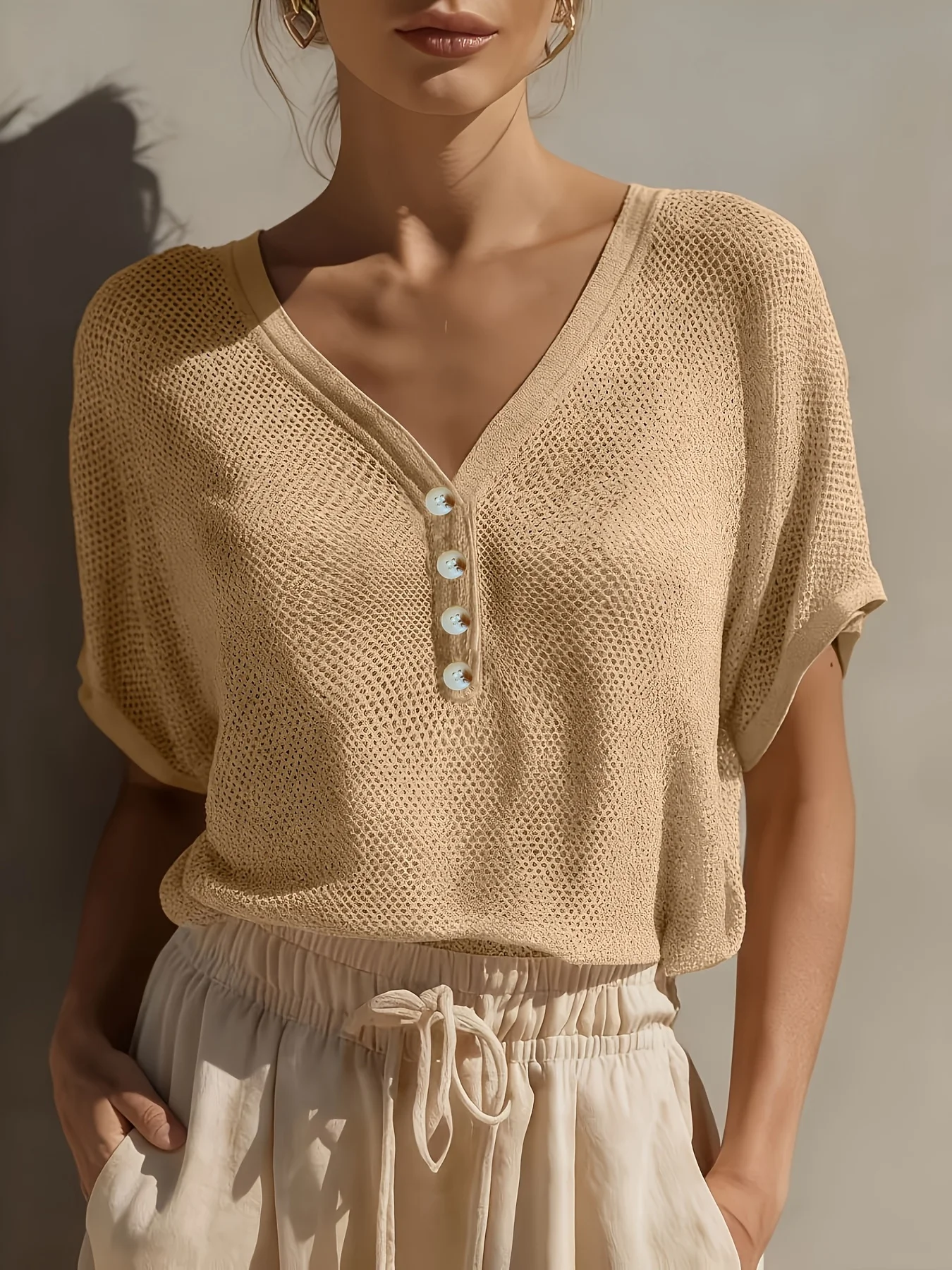Women's solid color hollow button decoration knitted short sleeved T-shirt, comfortable and versatile, suitable for summer
Women's solid color hollow button decoration knitted short sleeved T-shirt, comfortable and versatile, suitable for summer