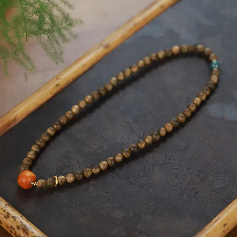 Natural Chinan agarwood 6mm beaded double circle bracelet, new Chinese style with Nanhong single bead niche plate play bracelet
Natural Chinan agarwood 6mm beaded double circle bracelet, new Chinese style with Nanhong single bead niche plate play bracelet
