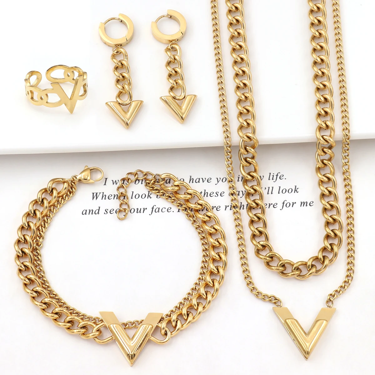 Fashion Gold Layered Cuban Link Chain Letter V Pendant Necklace Bracelet and Earrings Party 4pcs Jewelry Set
Fashion Gold Layered Cuban Link Chain Letter V Pendant Necklace Bracelet and Earrings Party 4pcs Jewelry Set