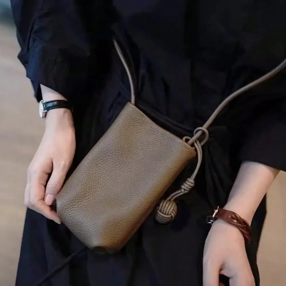 Artistic ball pendant mini bag, women's soft leather horizontal mobile phone bag, simple and gentle street photography artistic crossbody bag
Artistic ball pendant mini bag, women's soft leather horizontal mobile phone bag, simple and gentle street photography artistic crossbody bag