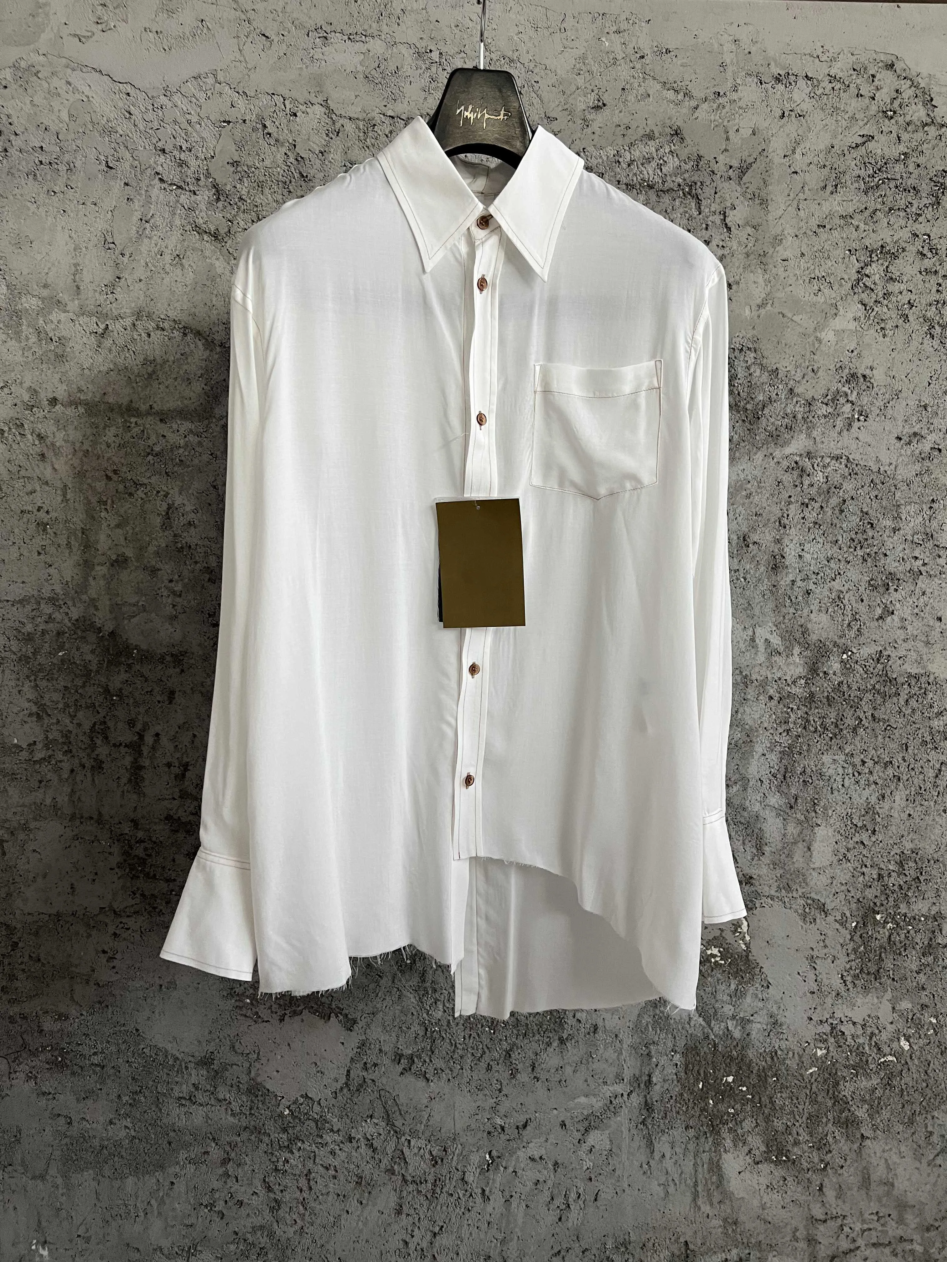 A semi-transparent white shirt by a Japanese designer
A semi-transparent white shirt by a Japanese designer