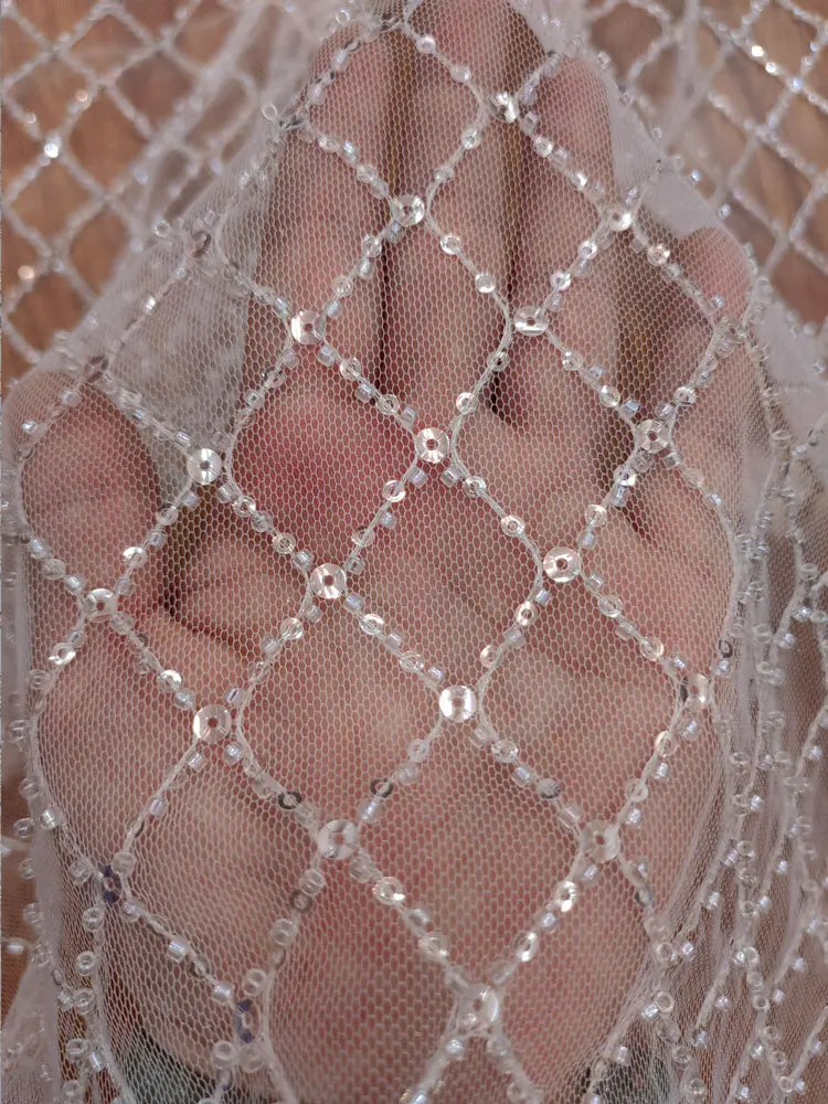 White Hollow Mesh Lace Fabric with Sequin Embroidery, Suitable for Custom Wedding Dresses Background Decoration Accessories
White Hollow Mesh Lace Fabric with Sequin Embroidery, Suitable for Custom Wedding Dresses Background Decoration Accessories
