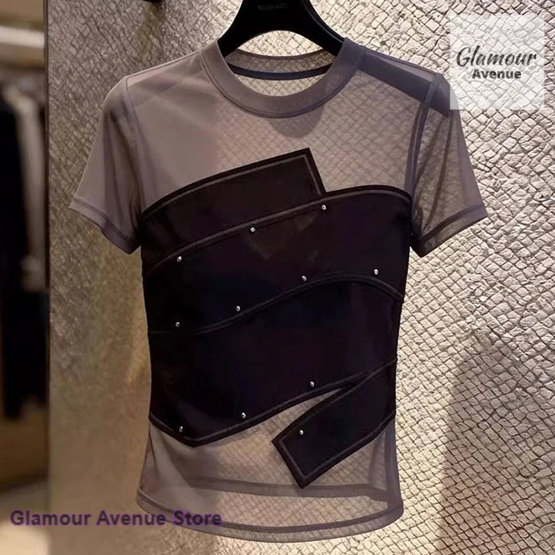 Korean fashion beaded gauze stitching short-sleeved T-shirt female summer new sexy niche design age-reducing casual Joker top.
Korean fashion beaded gauze stitching short-sleeved T-shirt female summer new sexy niche design age-reducing casual Joker top.