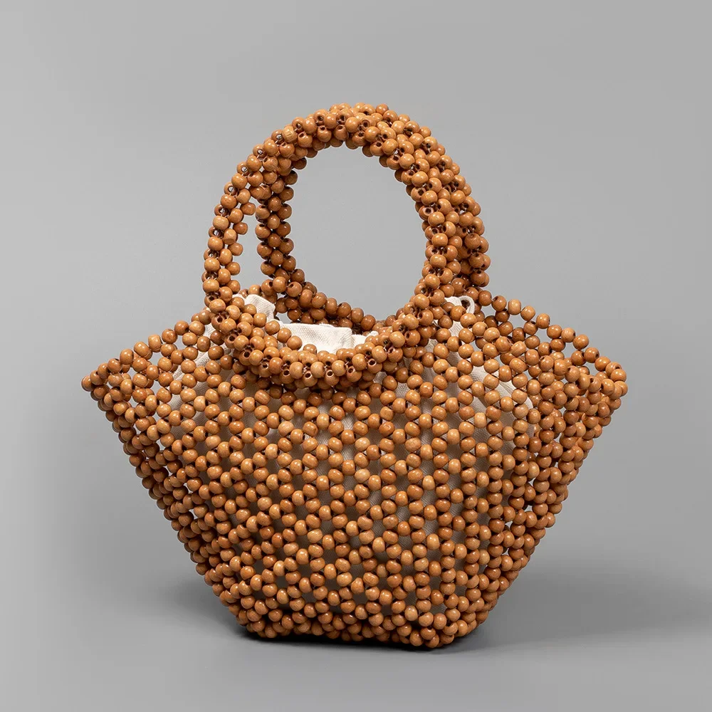 Handmade Beaded Handbag For Women Hollow-out Wooden Bead Bag Female Woven Bag
Handmade Beaded Handbag For Women Hollow-out Wooden Bead Bag Female Woven Bag