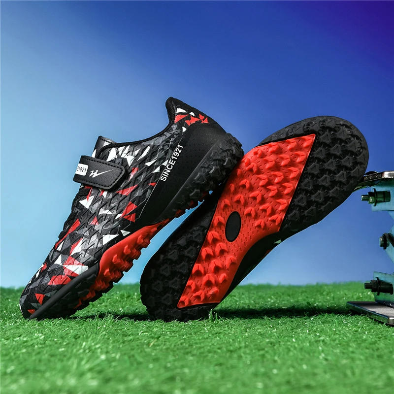 A pair of children's football cleats with hook-and-loop strap, non-slip studded sole for training and matches BD-66798
A pair of children's football cleats with hook-and-loop strap, non-slip studded sole for training and matches BD-66798