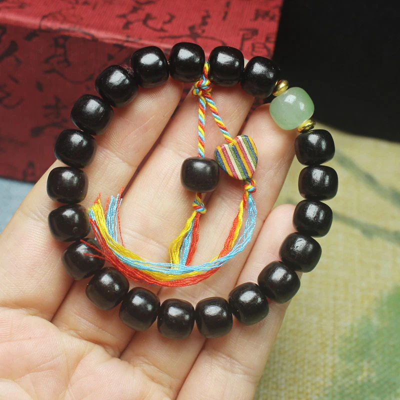 Ebony vintage-style bead bracelet with heart-shaped tassels, women's collectible accessory, Buddhist prayer beads
Ebony vintage-style bead bracelet with heart-shaped tassels, women's collectible accessory, Buddhist prayer beads