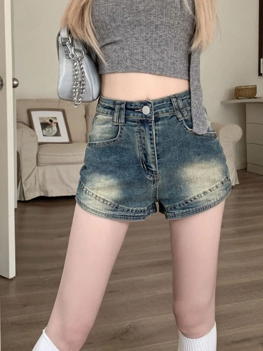 Ретро джинсовые шорты с высокой талией и эффектом потертости для женщин, летние, новые, в стиле Spicy Girl, утягивающие, А-силуэт, из хлопковой эластичной ткани
Ретро джинсовые шорты с высокой талией и эффектом потертости для женщин, летние, новые, в стиле Spicy Girl, утягивающие, А-силуэт, из хлопковой эластичной ткани