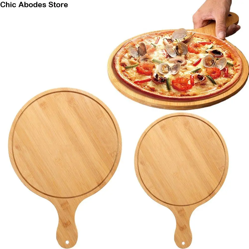 High Quality Durable Wooden Pizza Paddle Bamboo with Handle Pizza Making Peel Round Hanging Hole Pizza Baking Tray Kitchenware
High Quality Durable Wooden Pizza Paddle Bamboo with Handle Pizza Making Peel Round Hanging Hole Pizza Baking Tray Kitchenware