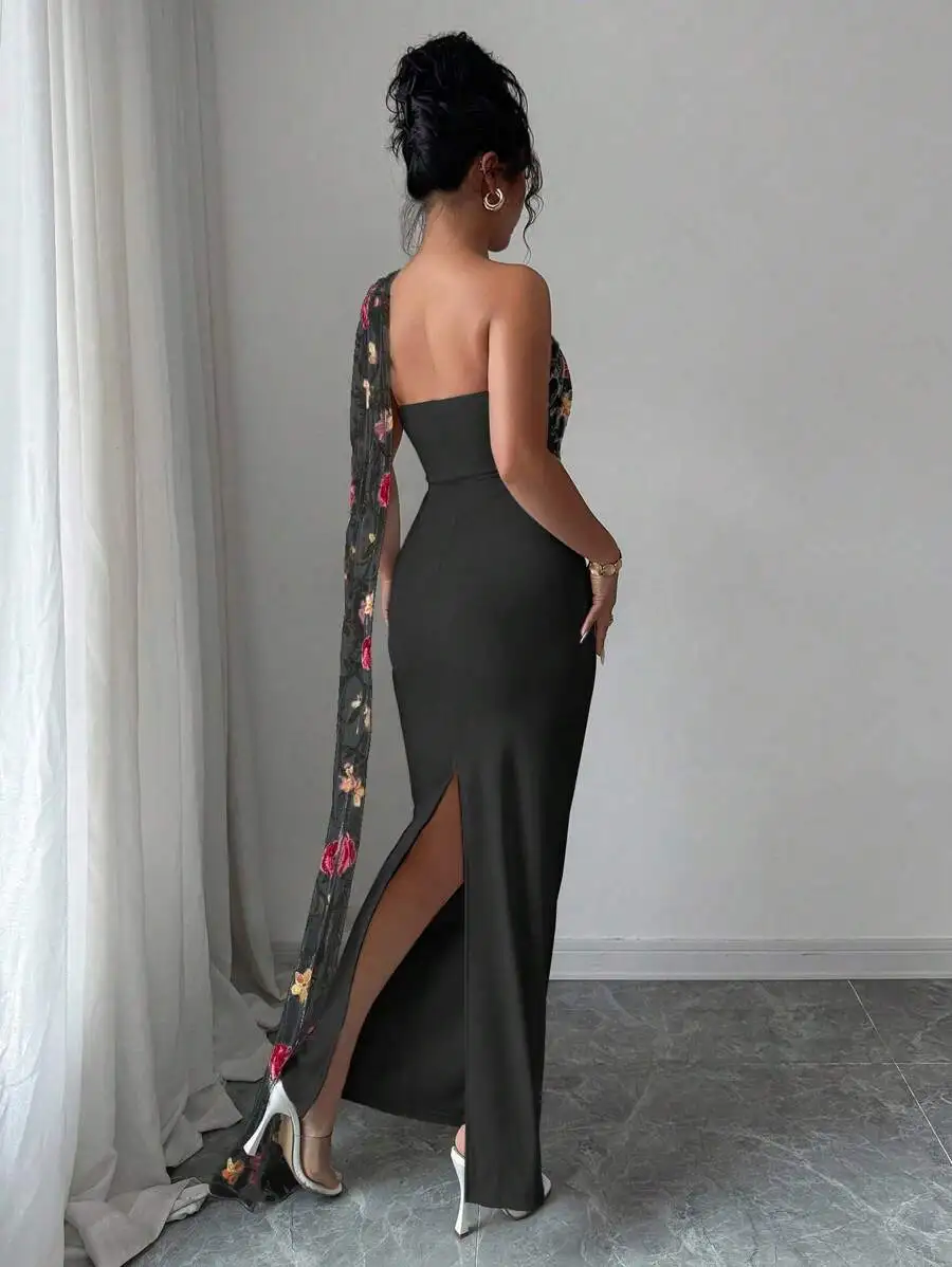 Black Solid Maxi Dress With One-Shoulder Floral Embroidered Sheer Mesh Drape And High Slit For Women
Black Solid Maxi Dress With One-Shoulder Floral Embroidered Sheer Mesh Drape And High Slit For Women