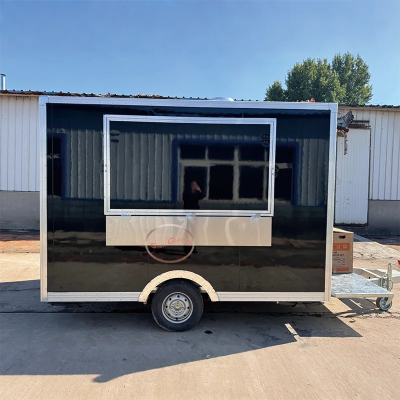 The glossy black body of the outdoor food trailer is sleek, eye-catching, and exudes an air of sophistication and grandeur
The glossy black body of the outdoor food trailer is sleek, eye-catching, and exudes an air of sophistication and grandeur