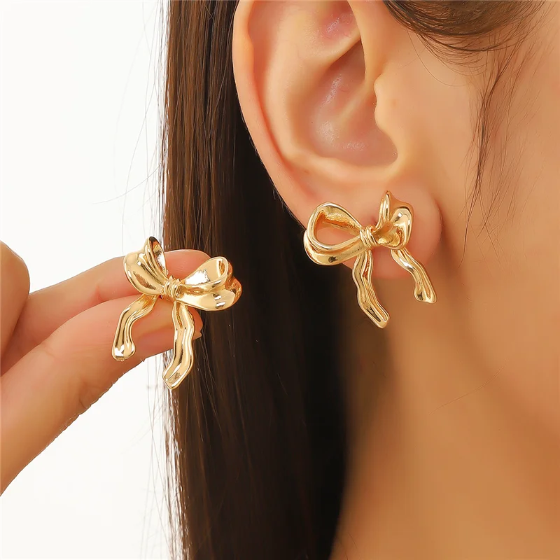 Sweet Gold Color Metal Ribbon Bow Knot Earrings for Women Girls Irregular Bowknot Ear Piercing Accessories Jewelry Gifts
Sweet Gold Color Metal Ribbon Bow Knot Earrings for Women Girls Irregular Bowknot Ear Piercing Accessories Jewelry Gifts