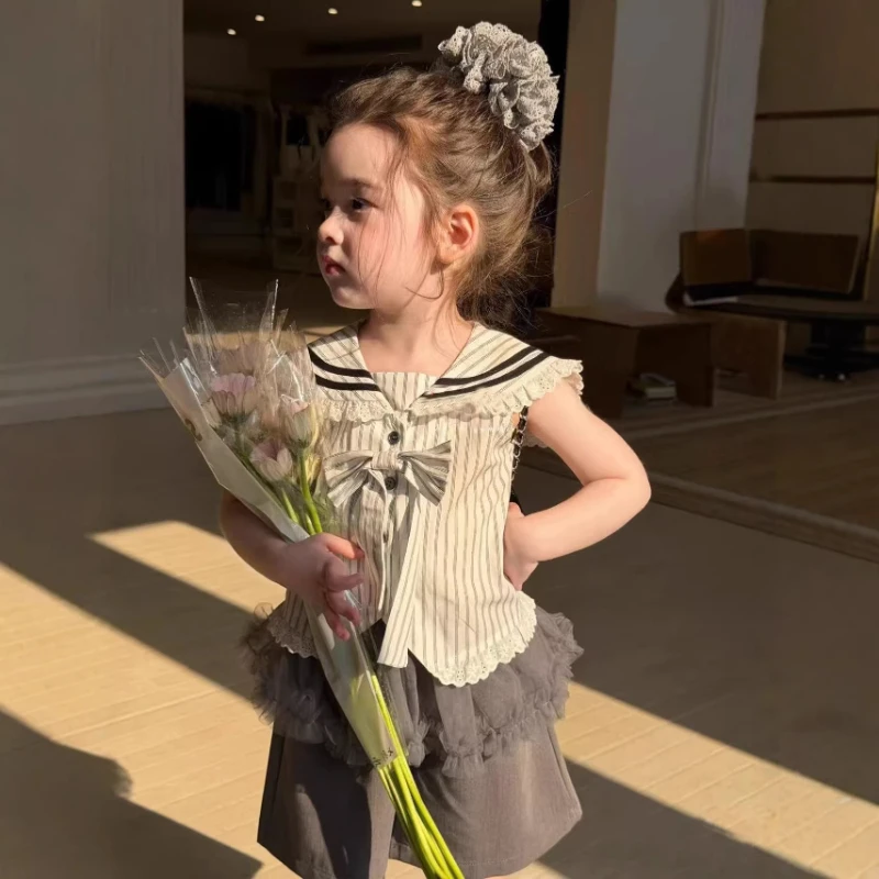 2026 Summer New Children's College Style Bow Vest Mesh Fart Curtain and Suit Shorts Three Piece Set
2026 Summer New Children's College Style Bow Vest Mesh Fart Curtain and Suit Shorts Three Piece Set