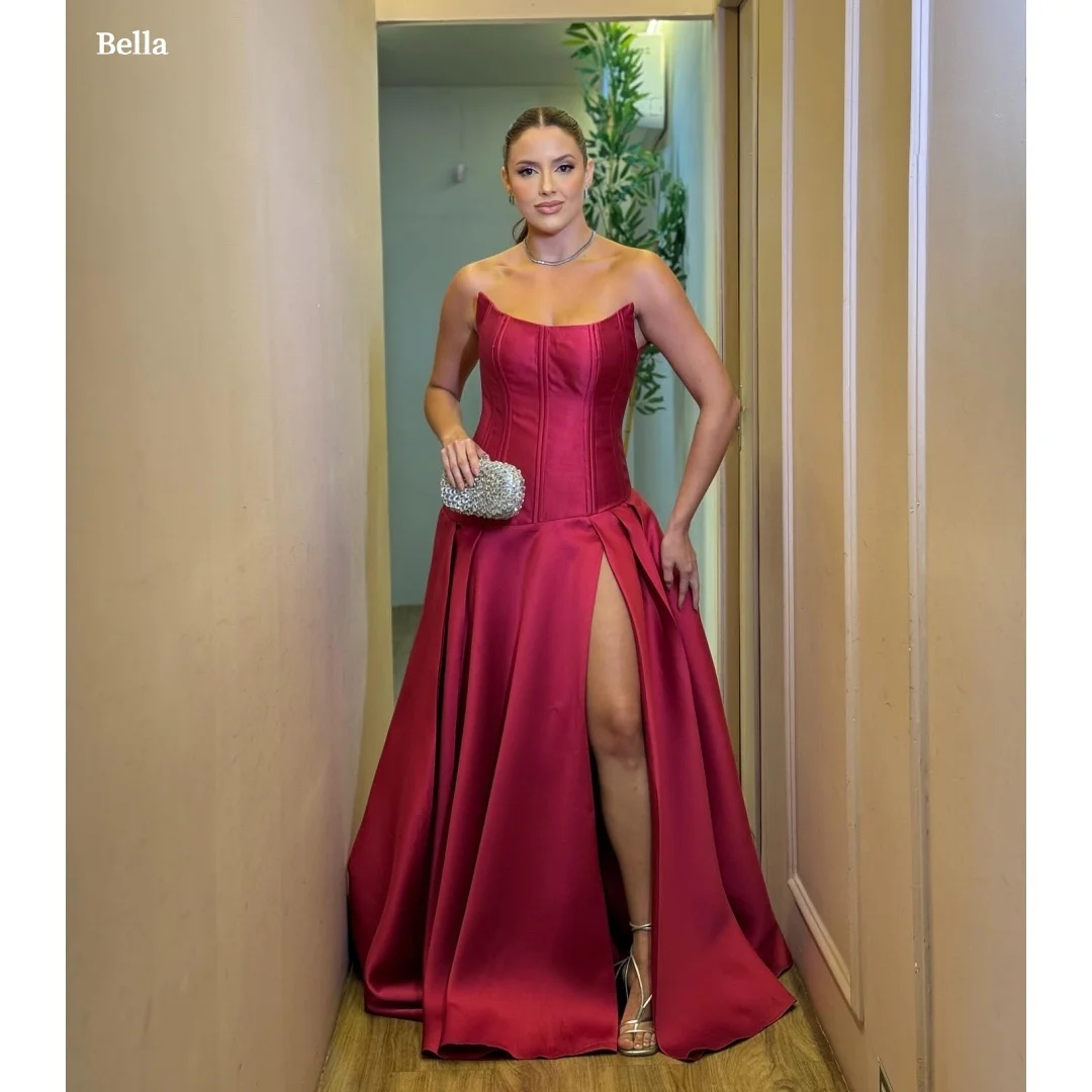 Bella Customized Burgundy Strapless Prom Dress with Satin Corset Bodice, High Slit and Voluminous Ball Gown Skirt Party Dresses
Bella Customized Burgundy Strapless Prom Dress with Satin Corset Bodice, High Slit and Voluminous Ball Gown Skirt Party Dresses
