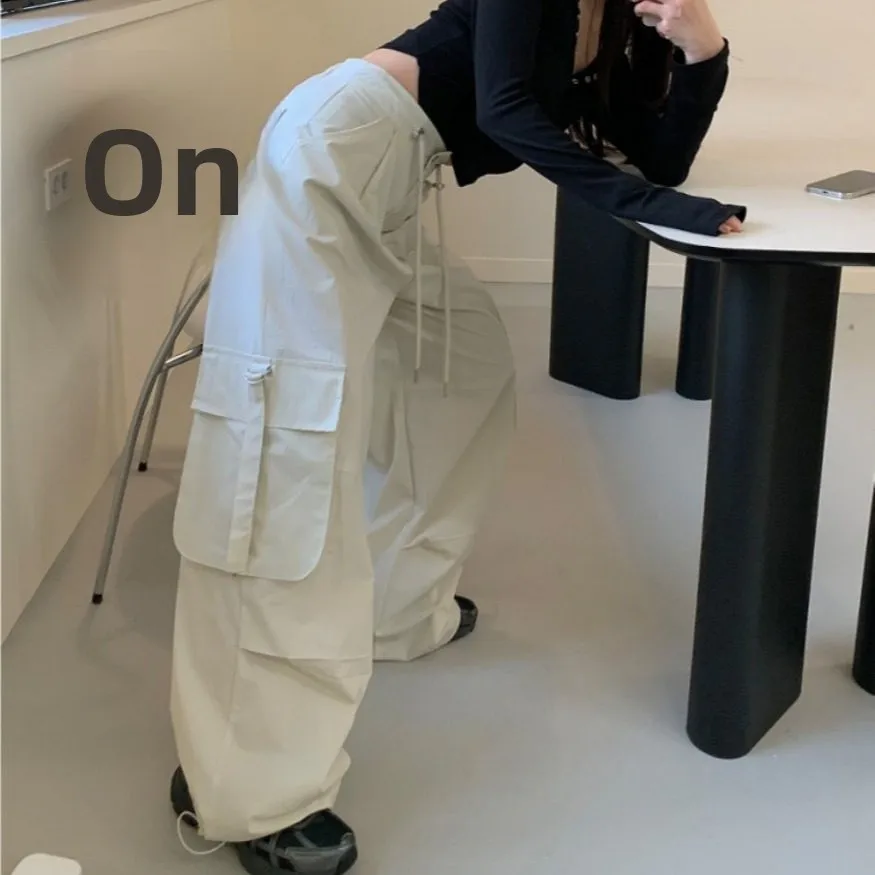 Повседневные женские брюки с высокой талией и широкими штанинами, свободного кроя, универсальные, прямые, с эластичным поясом, рабочие брюки, женская одежда Dongda Gate
Повседневные женские брюки с высокой талией и широкими штанинами, свободного кроя, универсальные, прямые, с эластичным поясом, рабочие брюки, женская одежда Dongda Gate