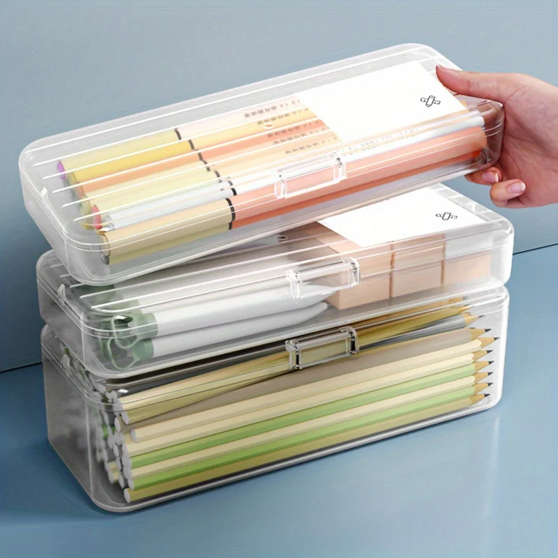 A transparent plastic storage box for pens, pencils, and home school office supplies
A transparent plastic storage box for pens, pencils, and home school office supplies